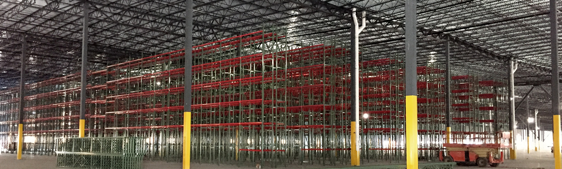 Inside view of industrial warehouse showing racking.