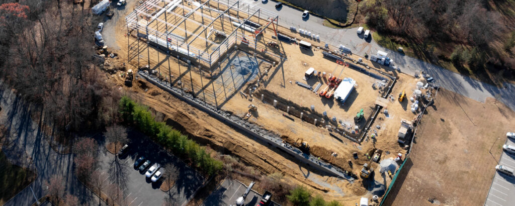 Drone photo of pre-engineered metal building being assembled.