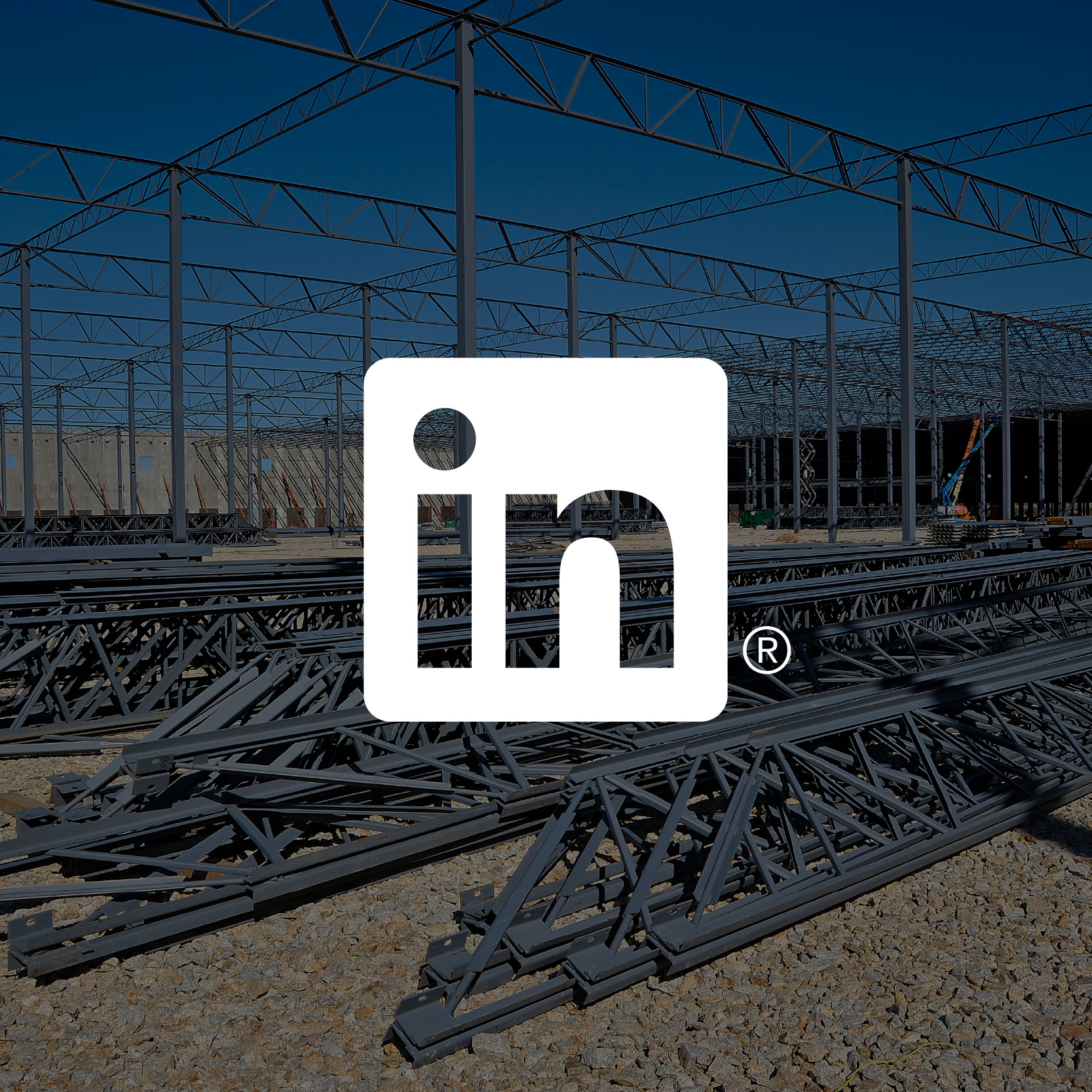 Dark transparency image of structural steel on jobsite with LinkedIn logo hyperlink in center.