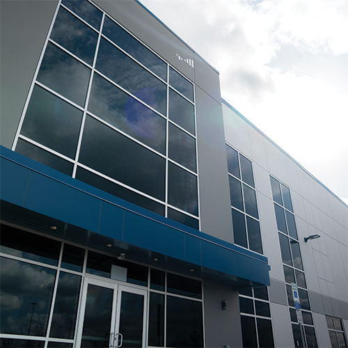 Industrial building entrance closeup to the sky