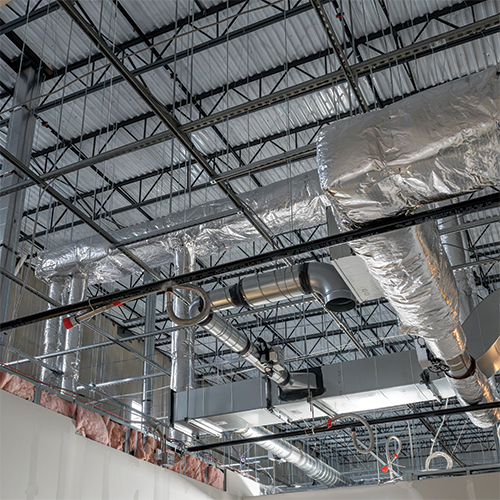 Exposed ceiling inside of an R&D facility's warehouse