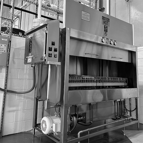 Black/white image of a pot washing station